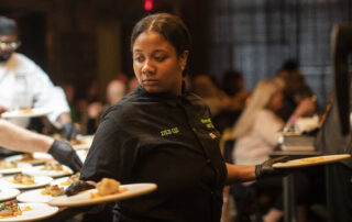 Daquana Sistrunk prepares the second course during Coldwater Kitchen Dinner and Movie at Frame in Hazel Park on Friday, April 28, 2023.