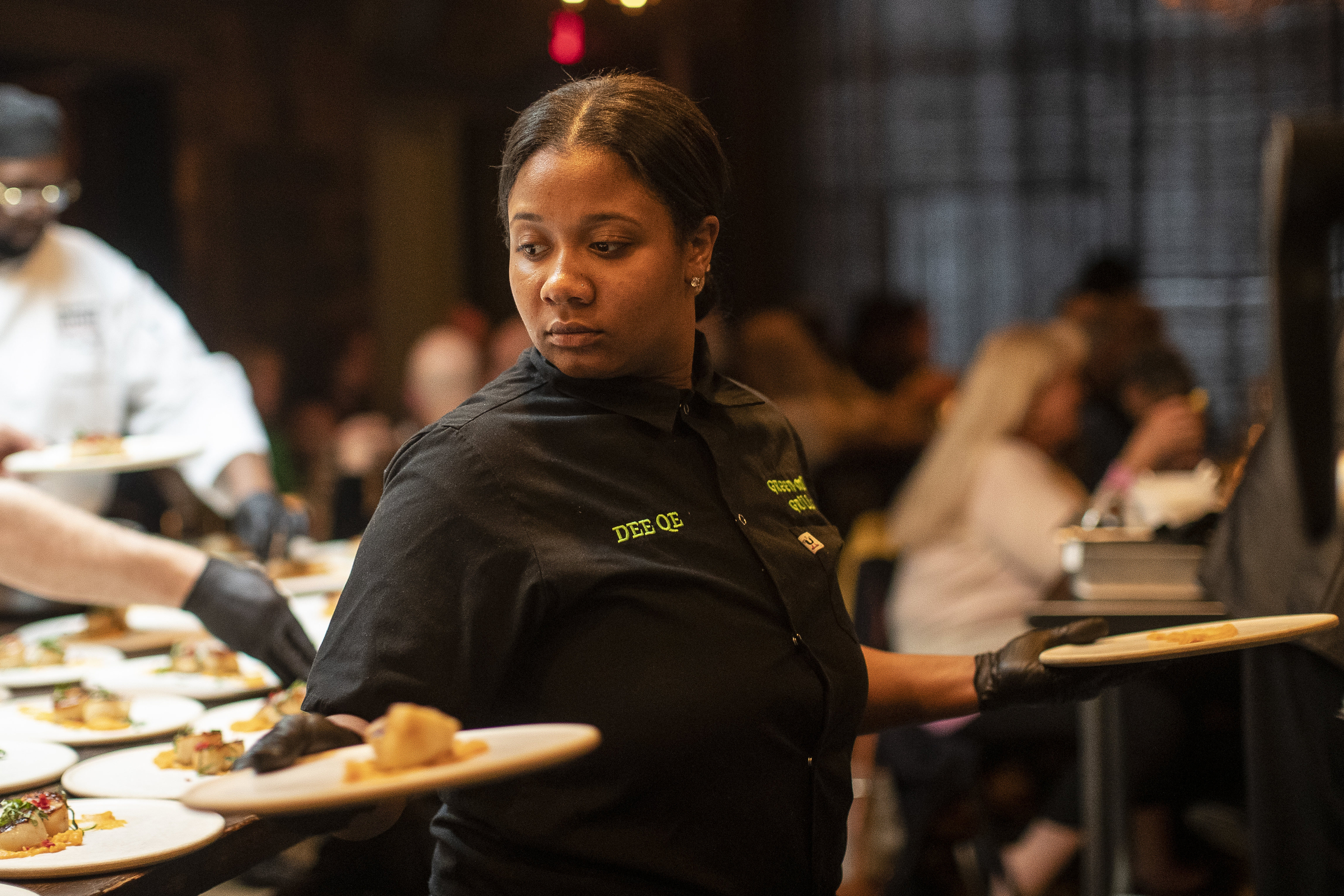 Daquana Sistrunk prepares the second course during Coldwater Kitchen Dinner and Movie at Frame in Hazel Park on Friday, April 28, 2023.