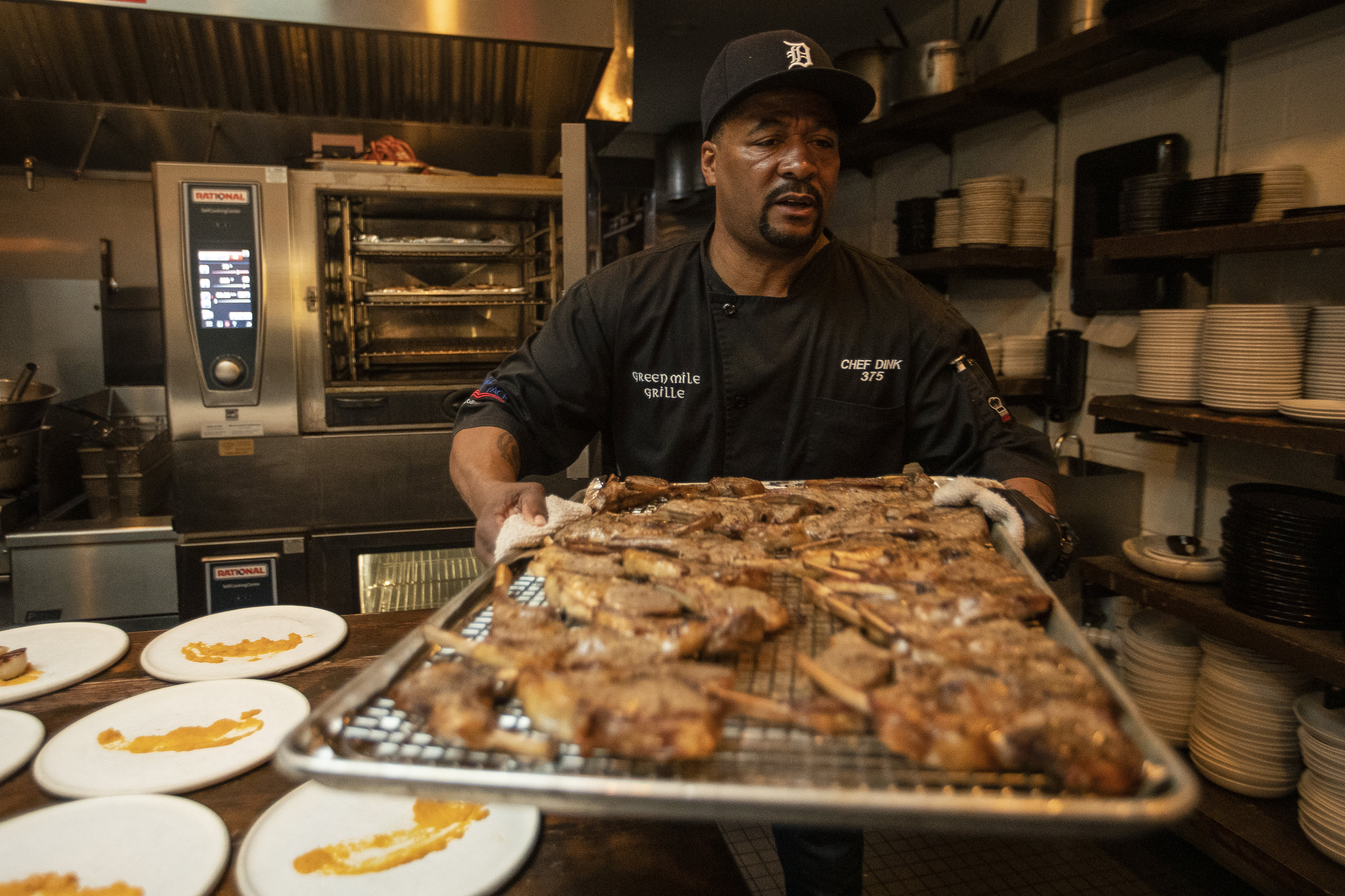 Chef Dink Dawson prepares lamb chop for the third course during Coldwater Kitchen Dinner and Movie at Frame in Hazel Park on Friday, April 28, 2023.